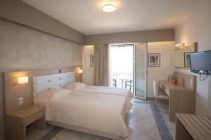 Postel nebo postele na pokoji v ubytování Hotel Philip