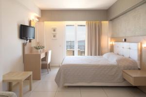 Postel nebo postele na pokoji v ubytování Hotel Philip