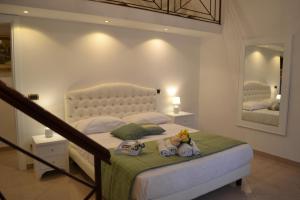 Tempat tidur dalam kamar di Dimora Real Maria