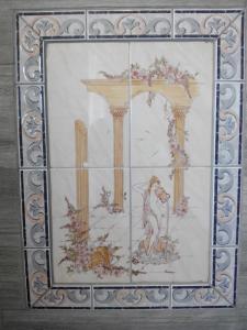 a framed picture of a painting of a woman at Vivenda Familia Pedro in Vila do Bispo