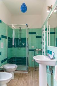 a bathroom with a shower and a toilet and a sink at Fili d'Erba Cilento in Villammare +56 photos