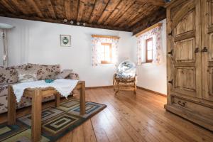 a living room with a couch and a table at Urlaub auf der Alm "Deluxe" in Preggraben