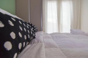 A bed or beds in a room at Gazi Area close to Metro