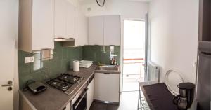 A kitchen or kitchenette at Gazi Area close to Metro