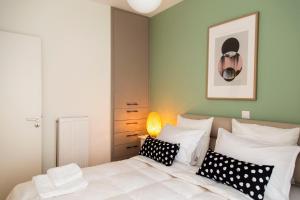 A bed or beds in a room at Gazi Area close to Metro