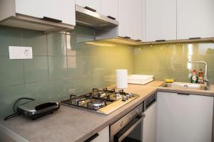 A kitchen or kitchenette at Gazi Area close to Metro