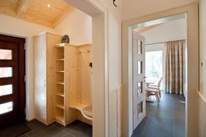 a room with a door leading to a living room at Haus Gartlblick in Großkirchheim