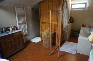 a bathroom with a shower and a sink and a tub at La Bourie in Le Girouard