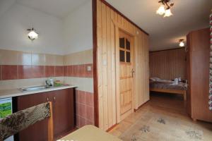 a kitchen with a sink and a counter top at Pokoje Janka Gliczarów Górny in Gliczarów