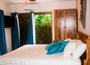 Rúm í herbergi á Hotel-Boutique Patampa