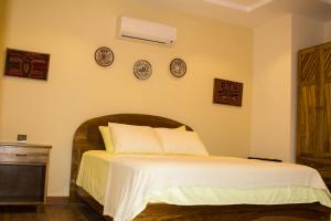 Rúm í herbergi á Hotel-Boutique Patampa