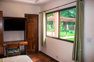 TV a/nebo společenská místnost v ubytování Hotel-Boutique Patampa