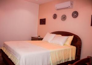 Rúm í herbergi á Hotel-Boutique Patampa
