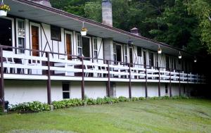 a building with white balconies on the side of it at The Lodge at Loon Lake in Chestertown