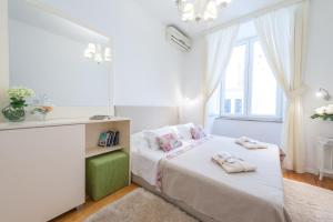 Postel nebo postele na pokoji v ubytování Guest House Flores