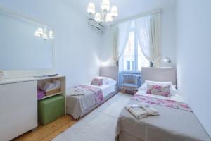 Postel nebo postele na pokoji v ubytování Guest House Flores