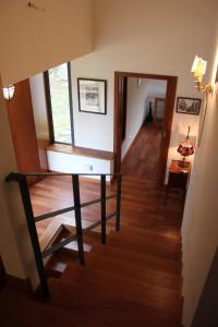 a view of a room with a table and a hallway at Casa do Lavadouro in Paços de Gaiolo