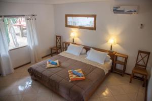 
Ein Bett oder Betten in einem Zimmer der Unterkunft Bajo Dive Resort
