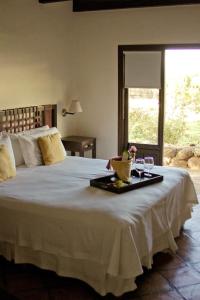 Кровать или кровати в номере Altalaluna Hotel Boutique & Spa +62 фотографии