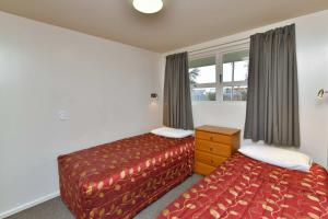 Postel nebo postele na pokoji v ubytování Wayside Motel