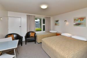 Postel nebo postele na pokoji v ubytování Wayside Motel + 37 fotografií