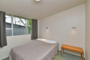 Postel nebo postele na pokoji v ubytování Wayside Motel