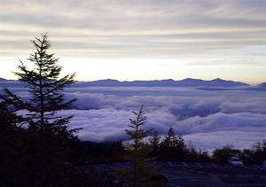 a view of the clouds from the top of a mountain at Fujikyu Unjokaku in Narusawa