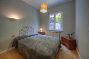 A bed or beds in a room at Appartamento in Villa a 5 KM dal mare