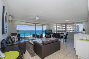 a living room with a view of the ocean at Baronnet Apartments in Gold Coast