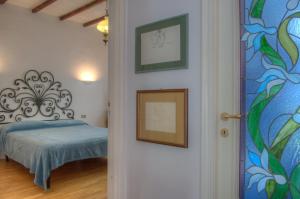 A bed or beds in a room at Appartamento in Villa a 5 KM dal mare