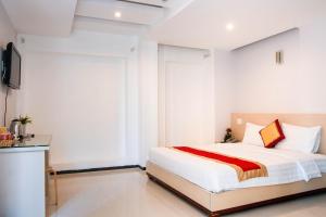 Postel nebo postele na pokoji v ubytování Le Duong Hotel