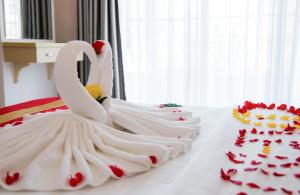 Postel nebo postele na pokoji v ubytování Le Duong Hotel