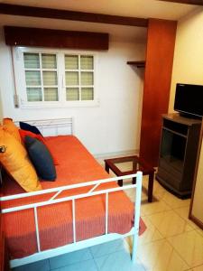 a bedroom with a bed and a window at Mar de Rosas in O Grove