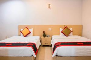 Postel nebo postele na pokoji v ubytování Le Duong Hotel