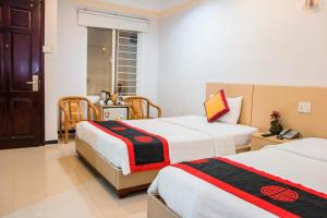 Postel nebo postele na pokoji v ubytování Le Duong Hotel