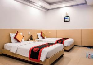 Postel nebo postele na pokoji v ubytování Le Duong Hotel