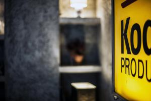 a yellow kodak logo sign on a wall at Kook Hotel Tarifa in Tarifa