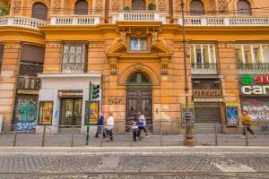 a building with people walking in front of it at Feronia Guest house in Rome