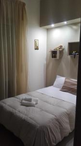 Ein Bett oder Betten in einem Zimmer der Unterkunft Meridiana B&B