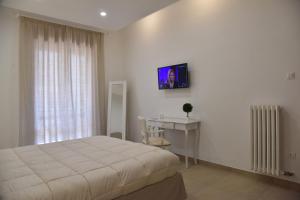 Un televizor și/sau centru de divertisment la Maison Veronique