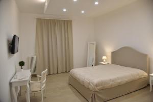 Un pat sau paturi într-o cameră la Maison Veronique