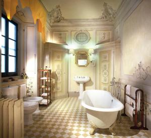 a bath room with a tub and a toilet at Villa Il Poggiale Dimora Storica in San Casciano in Val di Pesa