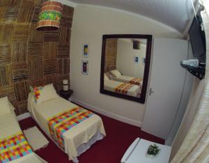 Giường trong phòng chung tại Pousada Villa Maria