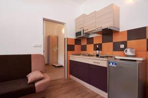 Kuchyňa alebo kuchynka v ubytovaní Apartmani B&B