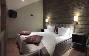 Postel nebo postele na pokoji v ubytování Hotel Bügelhof