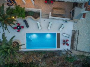 an overhead view of a swimming pool in a backyard at Villa Iž in Veli Iž