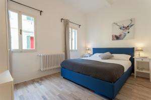En eller flere senge i et værelse på Casa Cosi - Sant Ambrogio