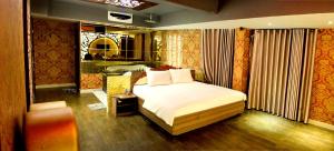 Postel nebo postele na pokoji v ubytování Bonita Grand Hotel
