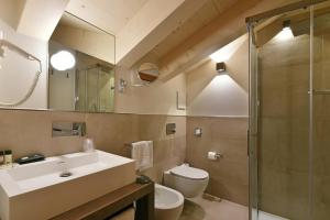 Kúpeľňa v ubytovaní Dolomeet Boutique Hotel