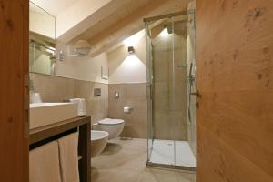 Kúpeľňa v ubytovaní Dolomeet Boutique Hotel